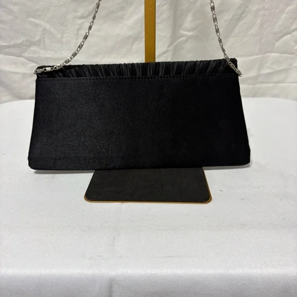 black pleated evening clutch bag with a detachable silver-tone chain strap. - Picture 3 of 5